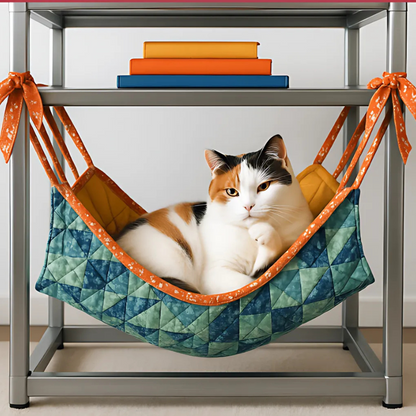 A calico cat relaxes in a cozy bed—a hammock made with the Cat Hammock Quilt Downloadable PDF Quilt Pattern—under a shelf of books, highlighting this charming and beginner-friendly quilting project.