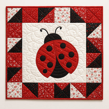 The Ladybug Downloadable PDF Quilt Pattern features a nature-inspired square quilt with a red and black ladybug center, bordered by red, black, and white triangles—ideal for intermediate quilters.