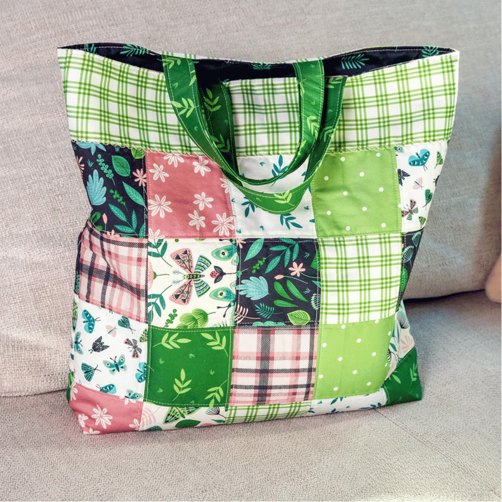 Add a touch of style to your collection with the Tote Bag Downloadable PDF Quilt Pattern—featuring green, pink, and white floral and plaid squares—ideal for making your own chic tote bag for any occasion.